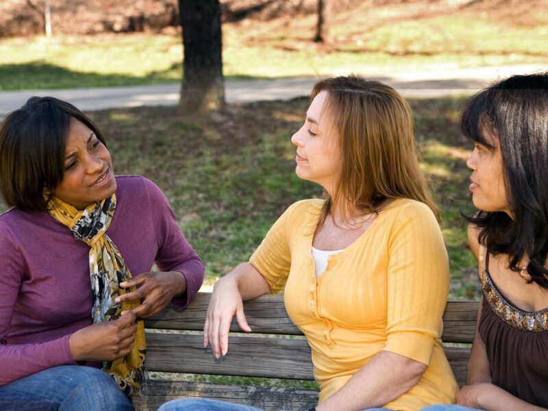 1800x1200 adult friends talking on park bench other