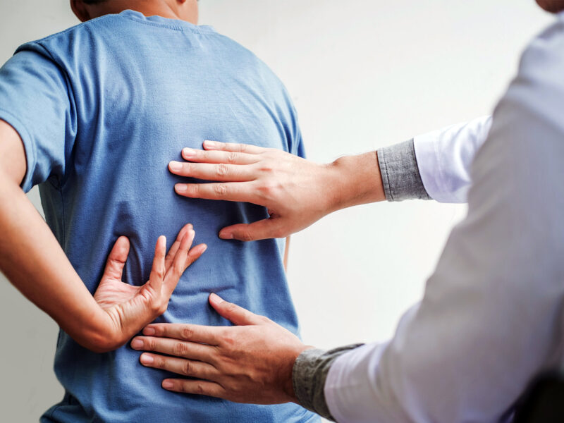 Why It Takes So Long to Diagnose Ankylosing Spondylitis 5 1800x1200 doctor examining patient with back pain other