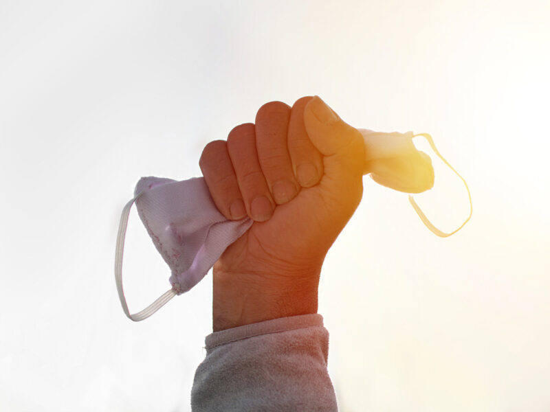 1800x1200 holding up face mask