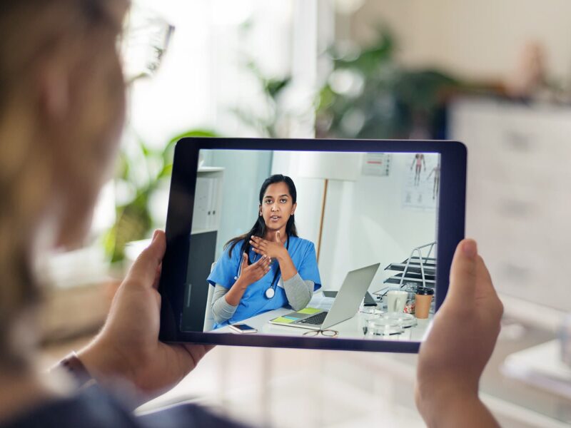 1800x1200 woman in video chat with doctor 2 other