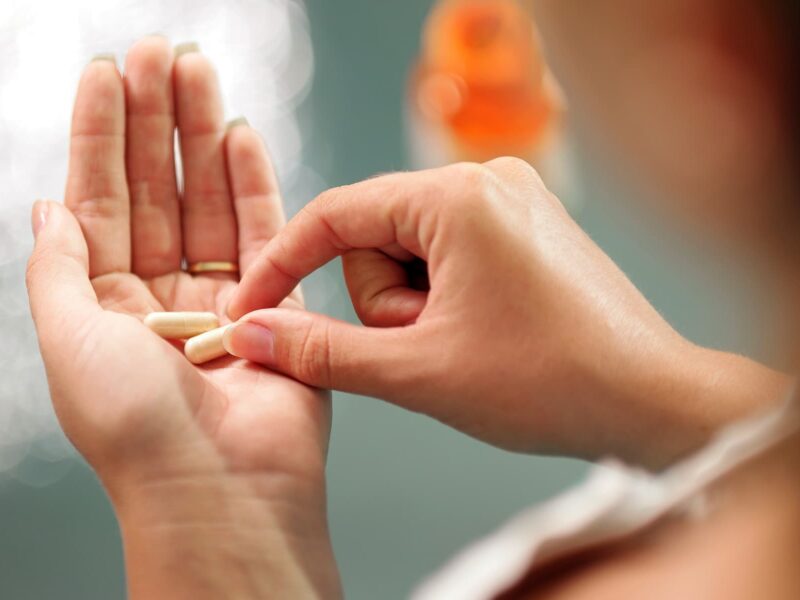 1800x1200 woman taking supplements other