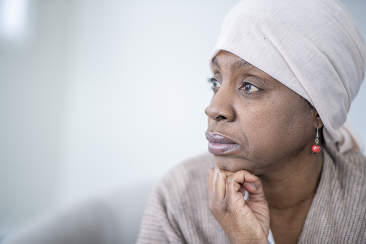 older African American woman looking thoughtful